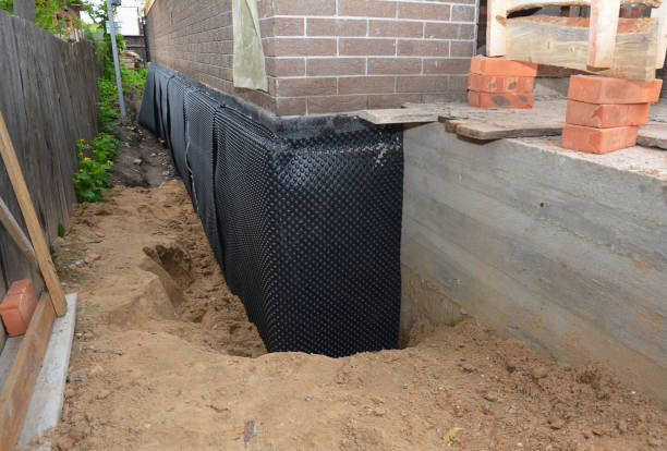 SJ Waterproofing Pros technician performing targeted Waterproofing assessment in Hightstown, NJ